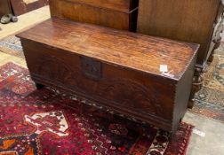 A 17th century and later carved oak six plank coffer, width 106cm, depth 38cm, height 48cm