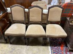 Three continental oak dining chairs.