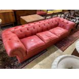 A Victorian style buttoned red leather Chesterfield settee, length 260cm, depth 90cm, height 68cm