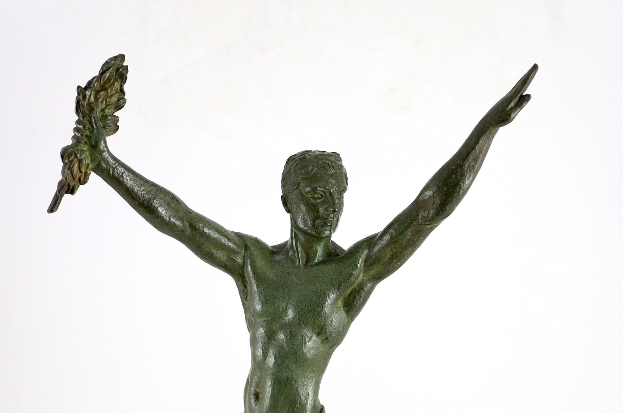 J. Darcourt. NB. An Art Deco patinated spelter figure of a victorious athlete, standing with arms - Image 3 of 5