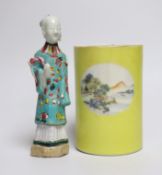 A Chinese yellow ground cylindrical brush pot, Republic period and a Jiaqing famille rose figure