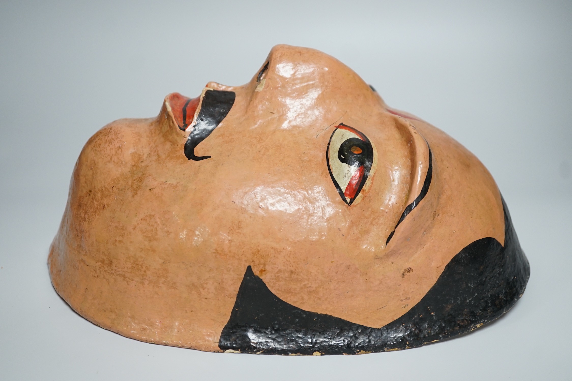 A papier mache wall mask of an Indian gentleman 32cm long