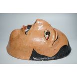 A papier mache wall mask of an Indian gentleman 32cm long
