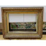 A late Victorian gilt gesso picture frame, aperture 52 x 34cm, overall 76 x 58cm