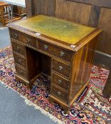 A reproduction 18th century style yew kneehole desk, length 76cm, depth 50cm, height 75cm