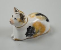 A rare small Staffordshire porcelain figure of a recumbent cat, c.1830-50. 6cm longCf. Dennis G.Rice
