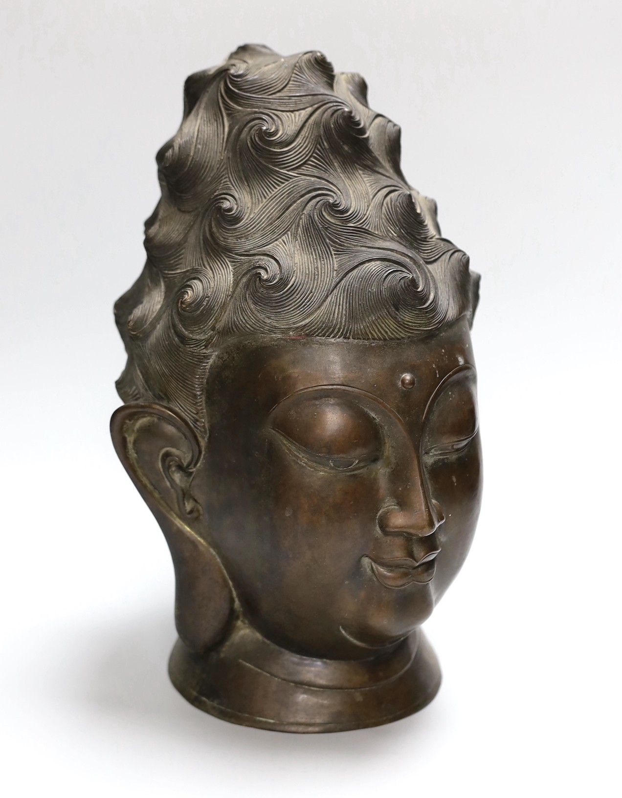 A South East Asian bronze bust of Guanyin, 34cm