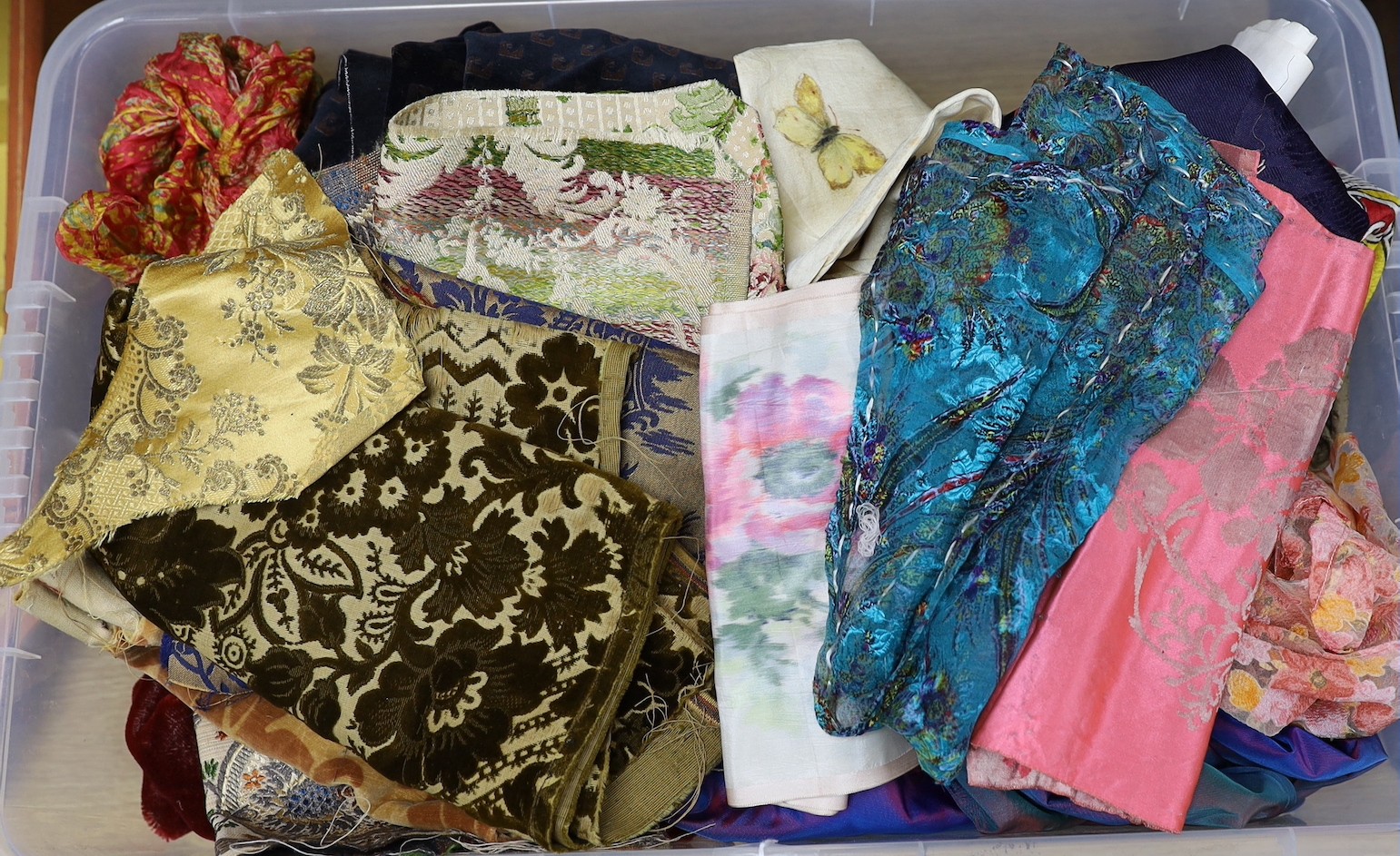 A collection of fabrics, silks, velvets and a shot silk taffeta skirt, ribbons and 19th century