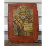 19th century South Russian School, tempera on wooden panel, Icon of St. Nicholas holding the