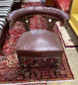 A Victorian oak and burgundy leather desk chair, width 66cm, depth 50cm, height 76cm