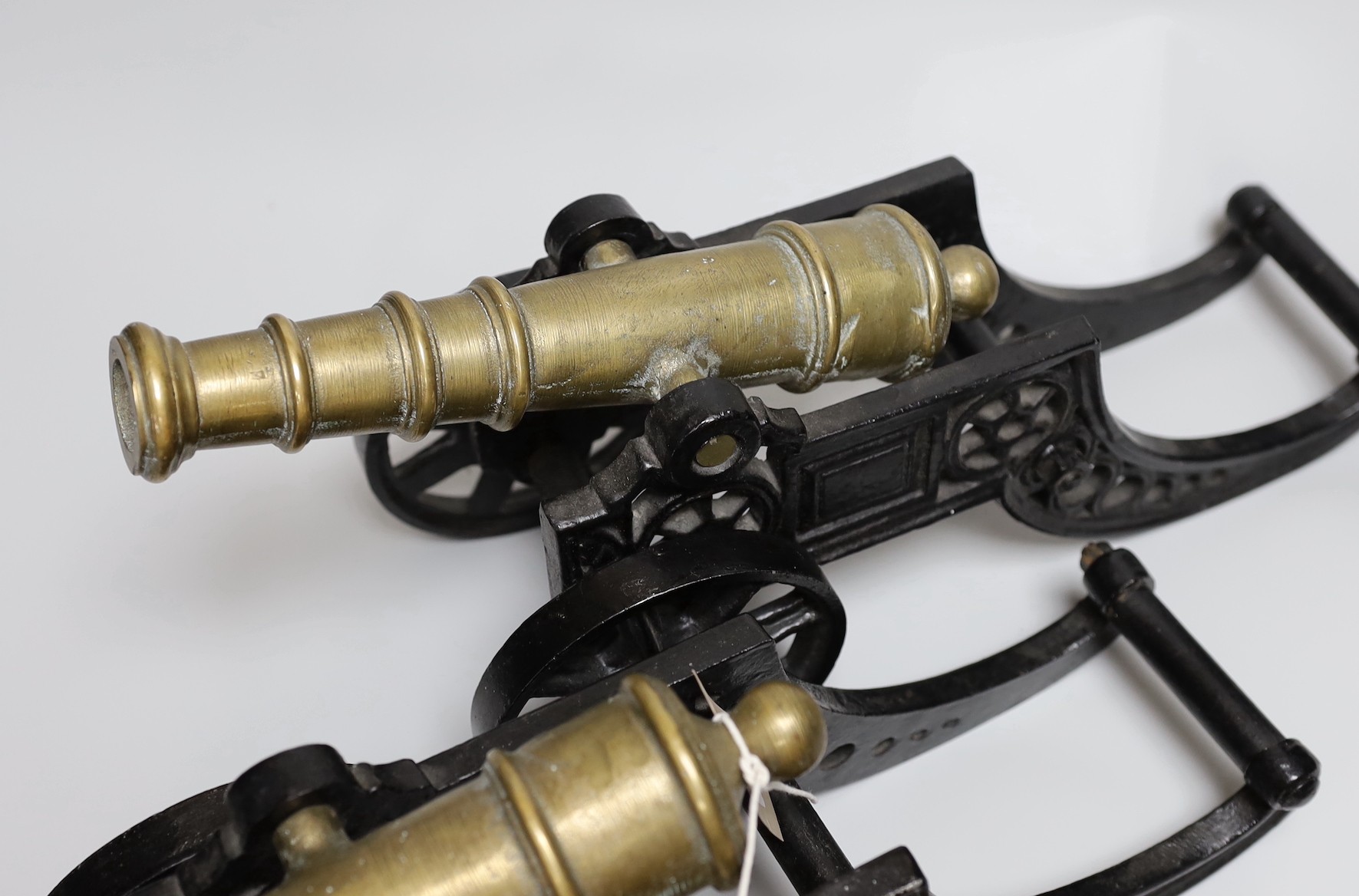 A pair of cast iron and bronze model cannons and a cast iron ‘dog’ nut cracker, cannons 42.5cm long - Image 3 of 3