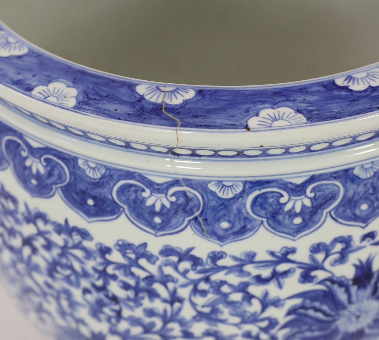 A Chinese blue and white ‘fish’ bowl, 20th century, painted with lotus flowers, scrolling tendrils - Image 3 of 5