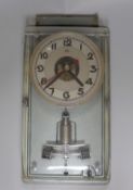 A vintage electric ATO wall clock