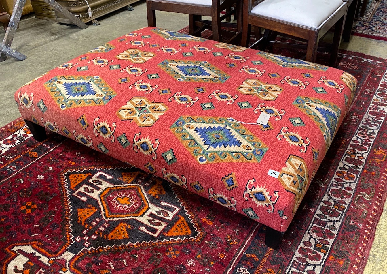 A large rectangular contemporary footstool upholstered in Kilim style fabric, length 122cm, depth