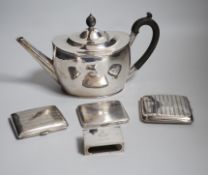 A George V silver oval teapot, Birmingham, 1913, three silver cigarette cases and a silver