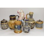 A group of six Doulton Lambeth stoneware vessels, tallest 22.5 cm and a French porcelain figure of a