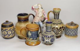 A group of six Doulton Lambeth stoneware vessels, tallest 22.5 cm and a French porcelain figure of a