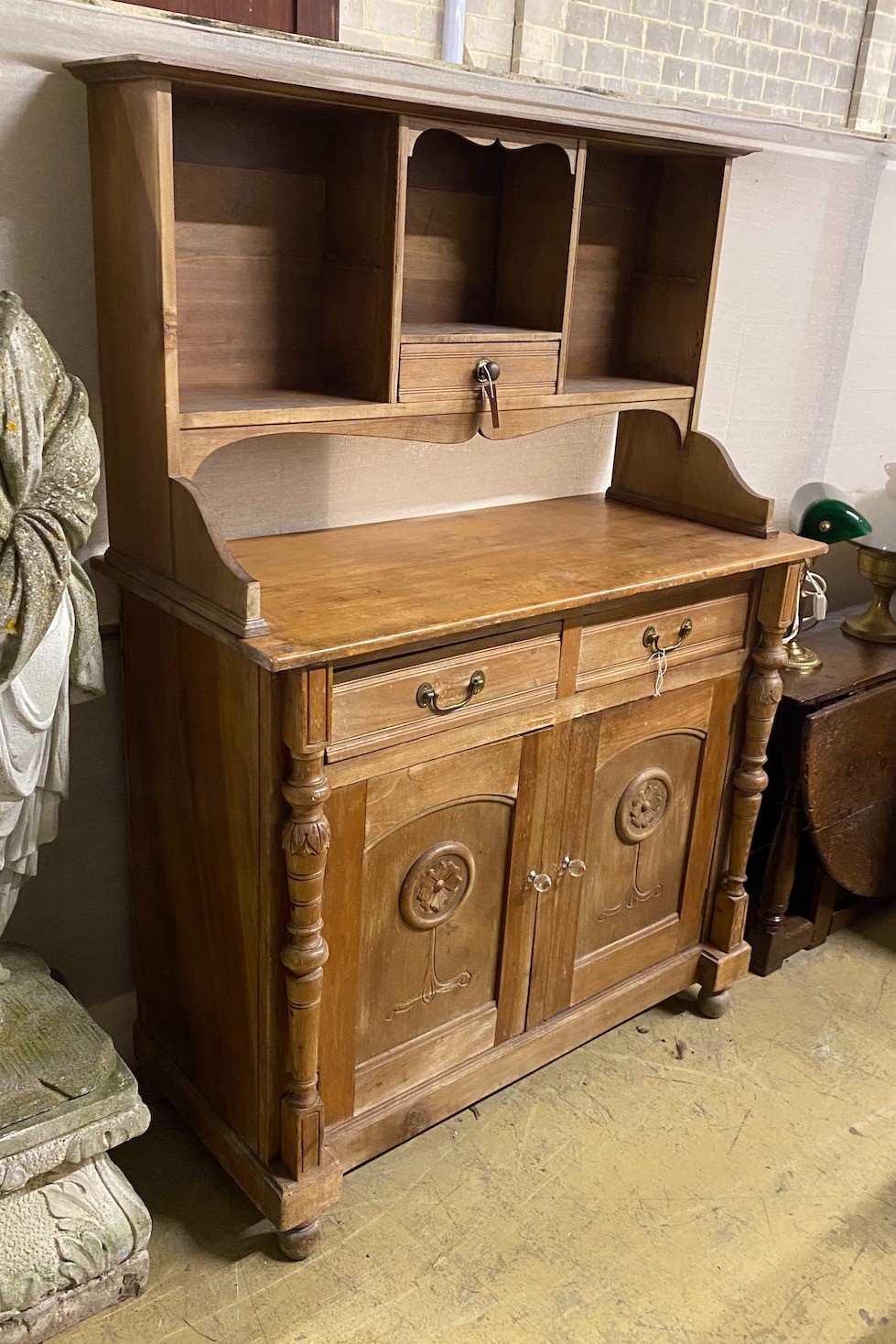 An early 20th century continental pine and walnut buffet, length 122cm, depth 53cm, height 173cm