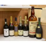 Various bottles of champagne, wine and brandy including a 1984 Warre's vintage port and a 1970