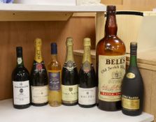 Various bottles of champagne, wine and brandy including a 1984 Warre's vintage port and a 1970