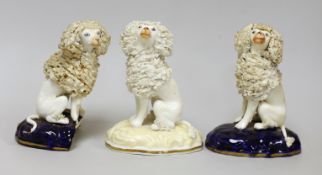 Three small Samuel Alcock models of seated poodles, c.1830-50. Tallest 9cms highProvenance: Dennis
