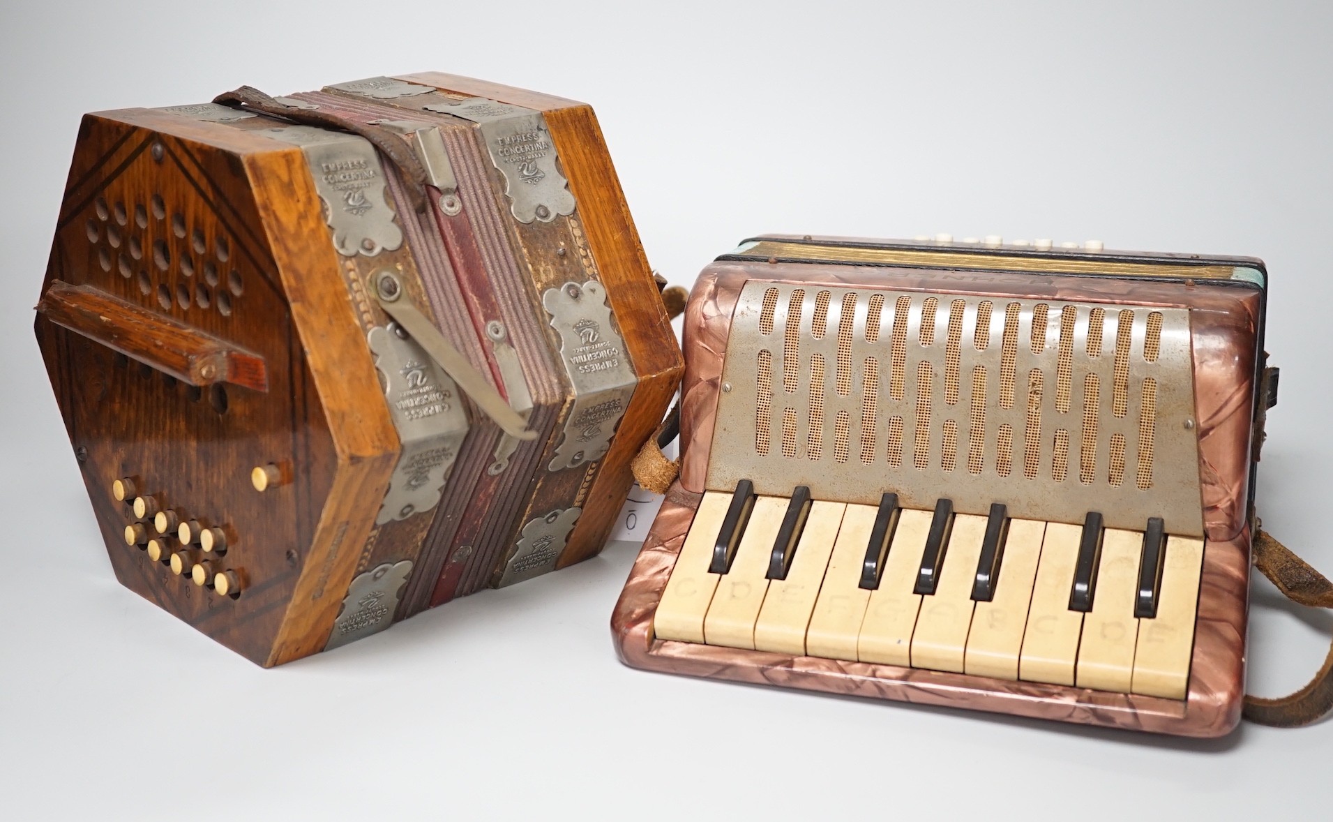 A Hohner Mignon accordion and an Empress concertina