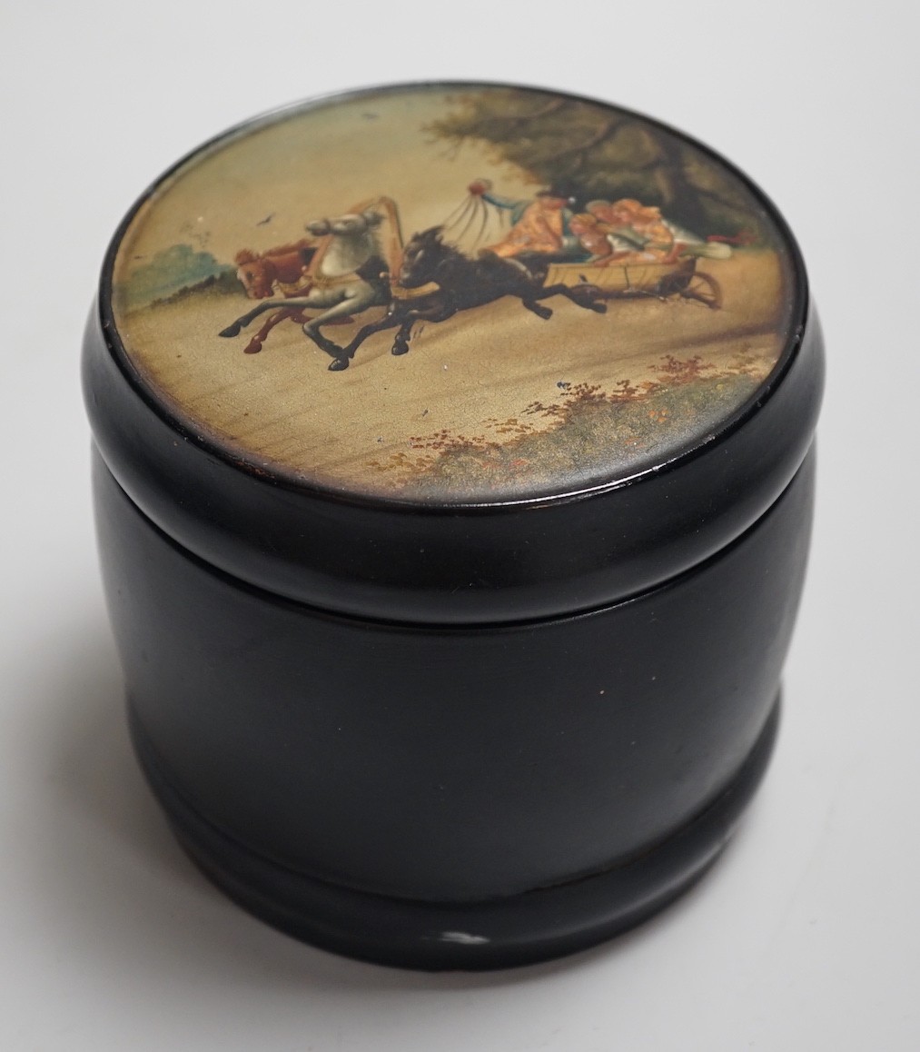 An early 20th century Russian lacquer tobacco box, the cover painted with a winter scene with