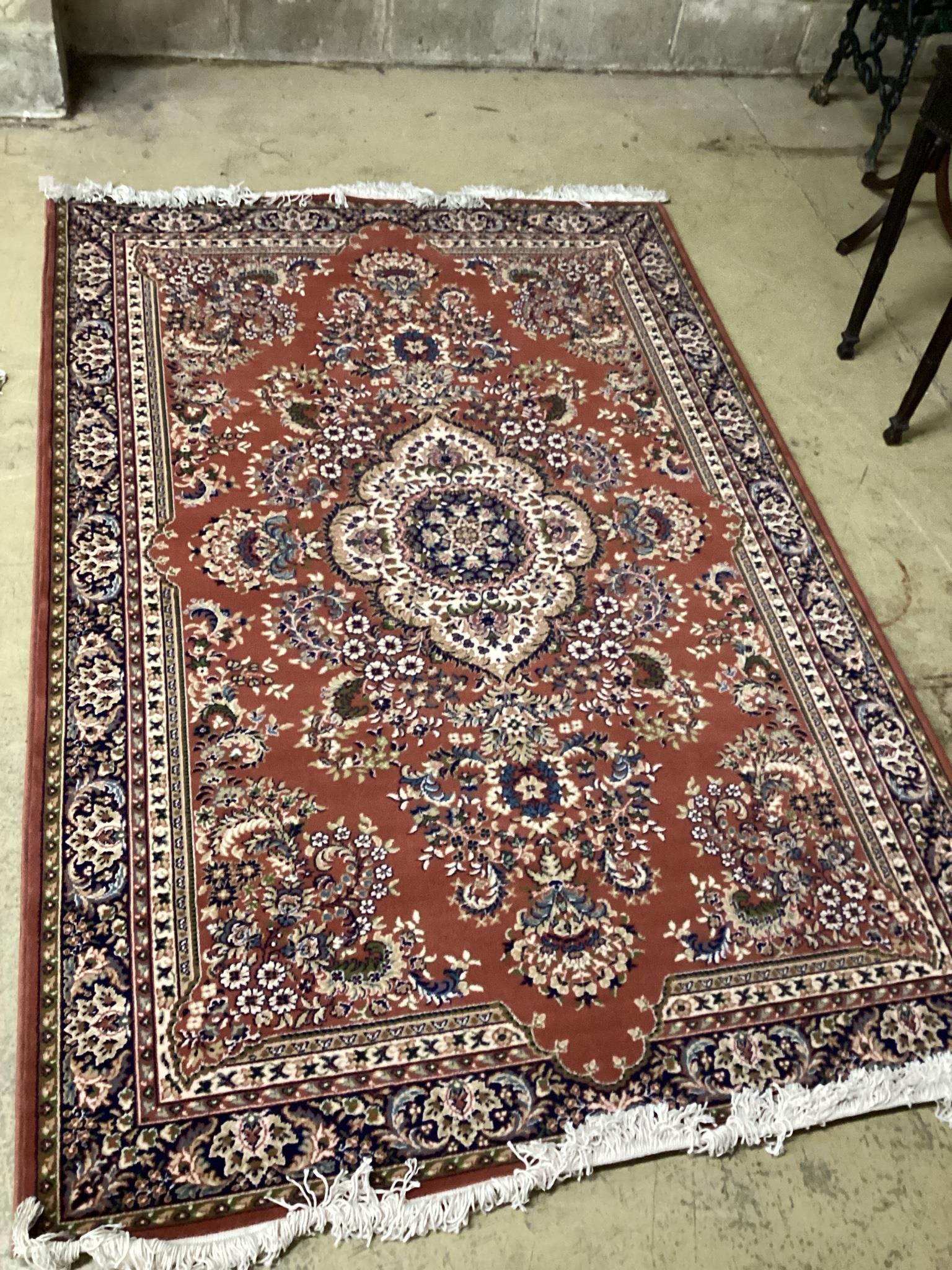 A modern Tabriz style red ground rug, 240 x 162cm