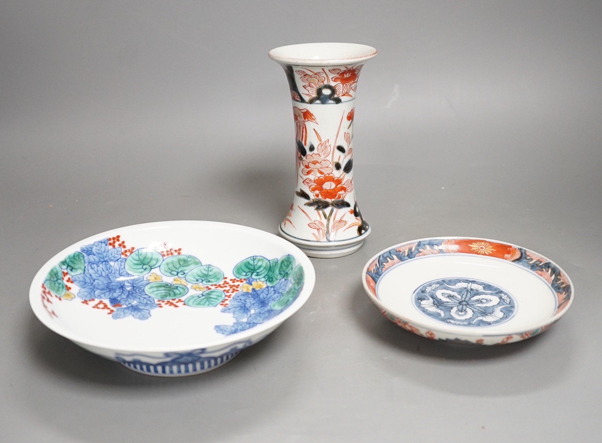 An 18th century Japanese Arita porcelain vase, a Nabeshima style dish and an Arita dish, height of