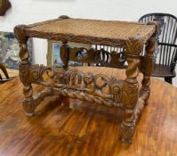A Jacobean revival carved oak cane seat stool width 52cm, depth 39cm, height 43cm.