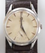 A gentleman's early 1950's stainless steel Omega wrist watch, with baton numerals and subsidiary