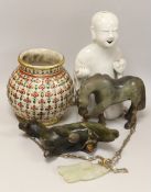 A 19th century Chinese pale celadon jade pendant a Chinese blanc de Chine figure, two soapstone