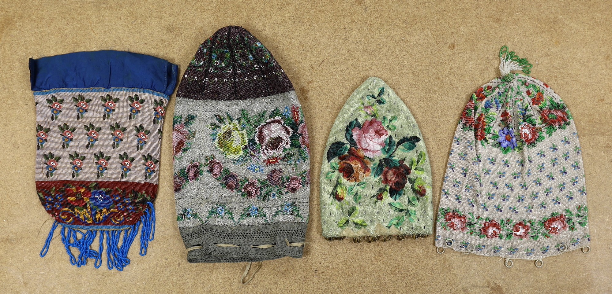 A 19th century floral beaded bag, possibly American and three other similar beaded bags (4)