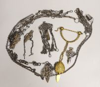 A 19th century cut steel Chatelaine, three others, a similar clasp and a later gilt metal Chatelaine