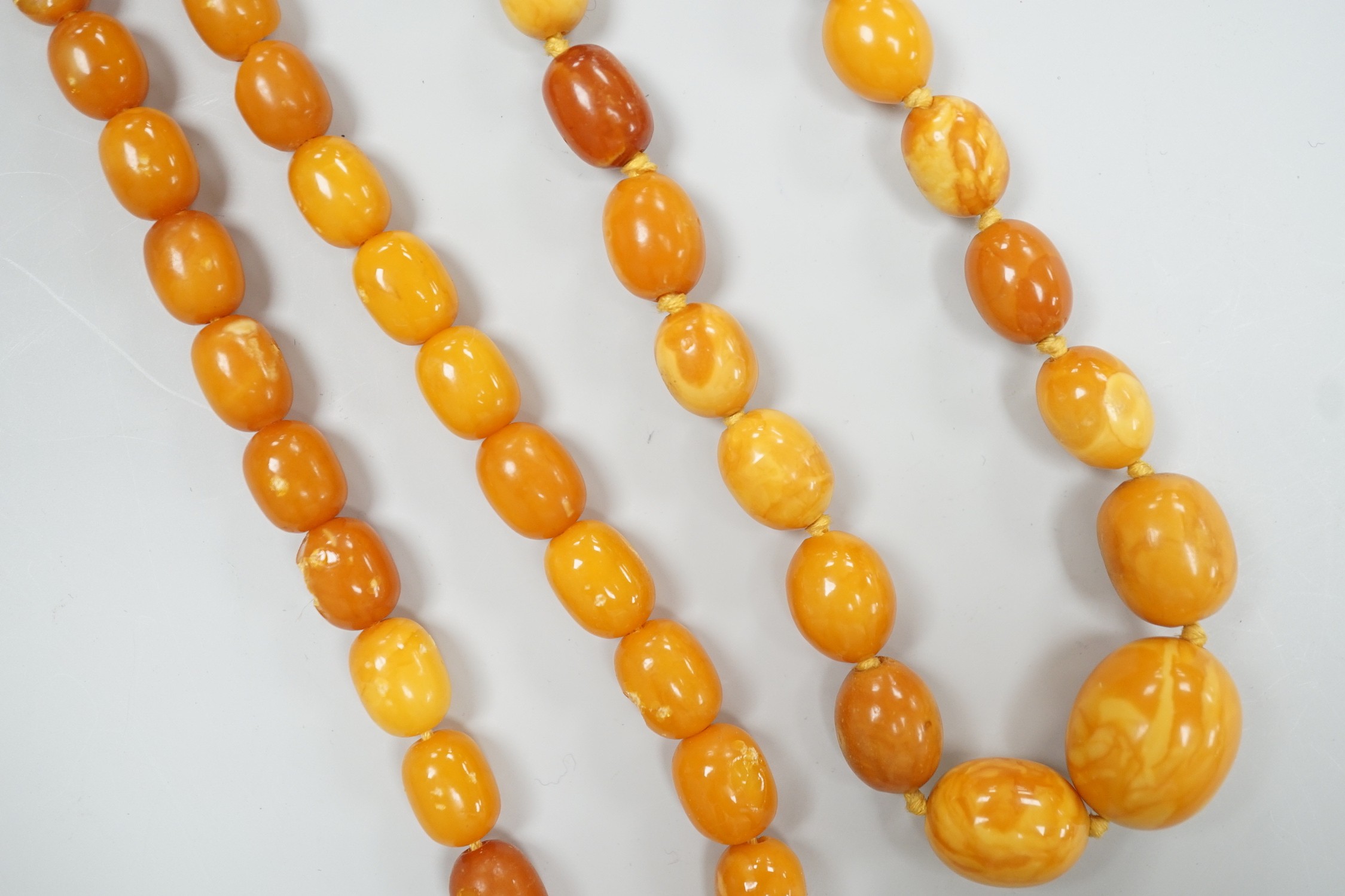 Two single strand graduated oval amber bead necklaces, one a.f., longest 43cm, gross weight 38 - Image 2 of 5