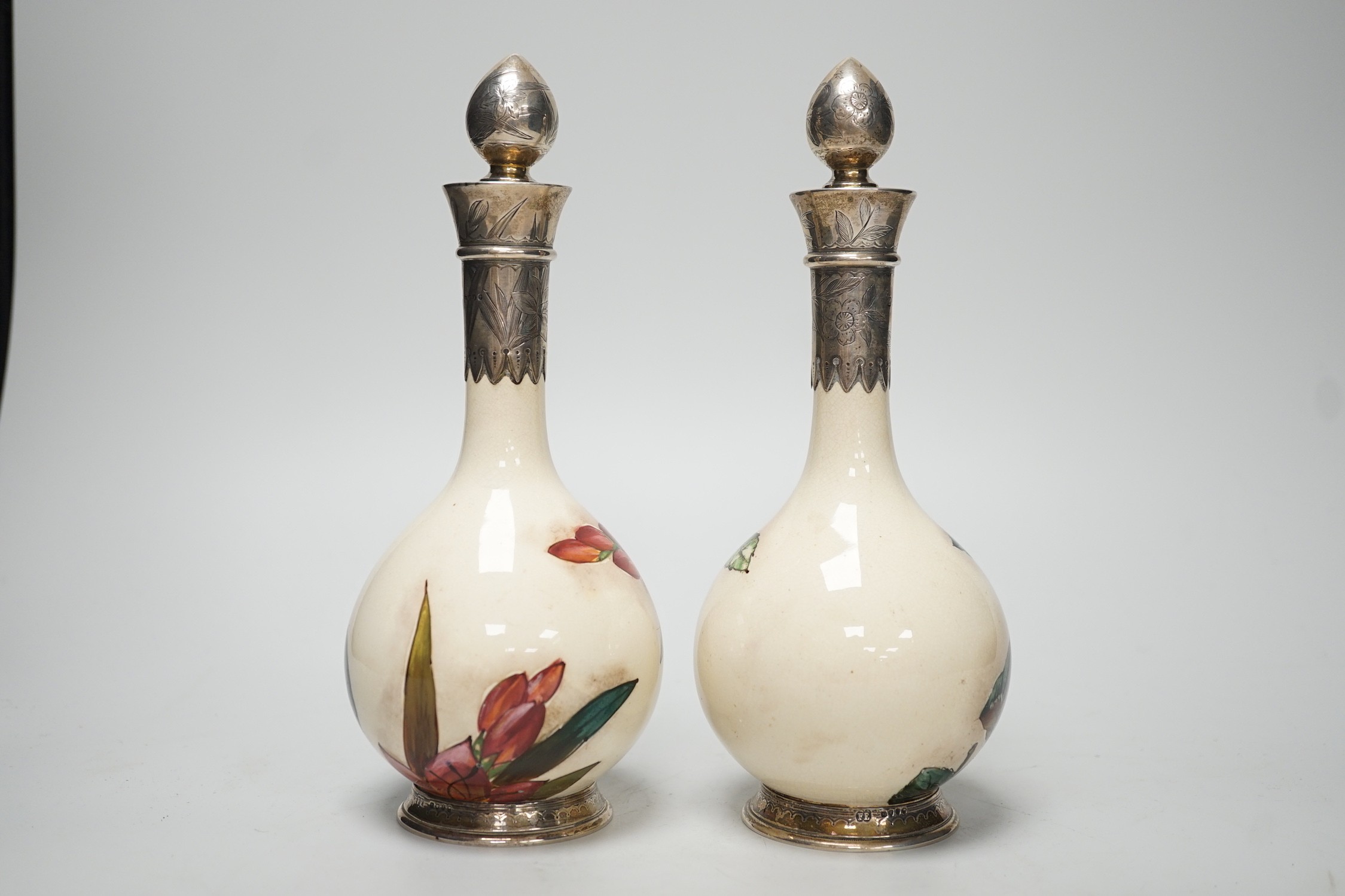 A pair of Victorian silver mounted floral painted earthenware bottle vases. 21cm high - Image 4 of 7