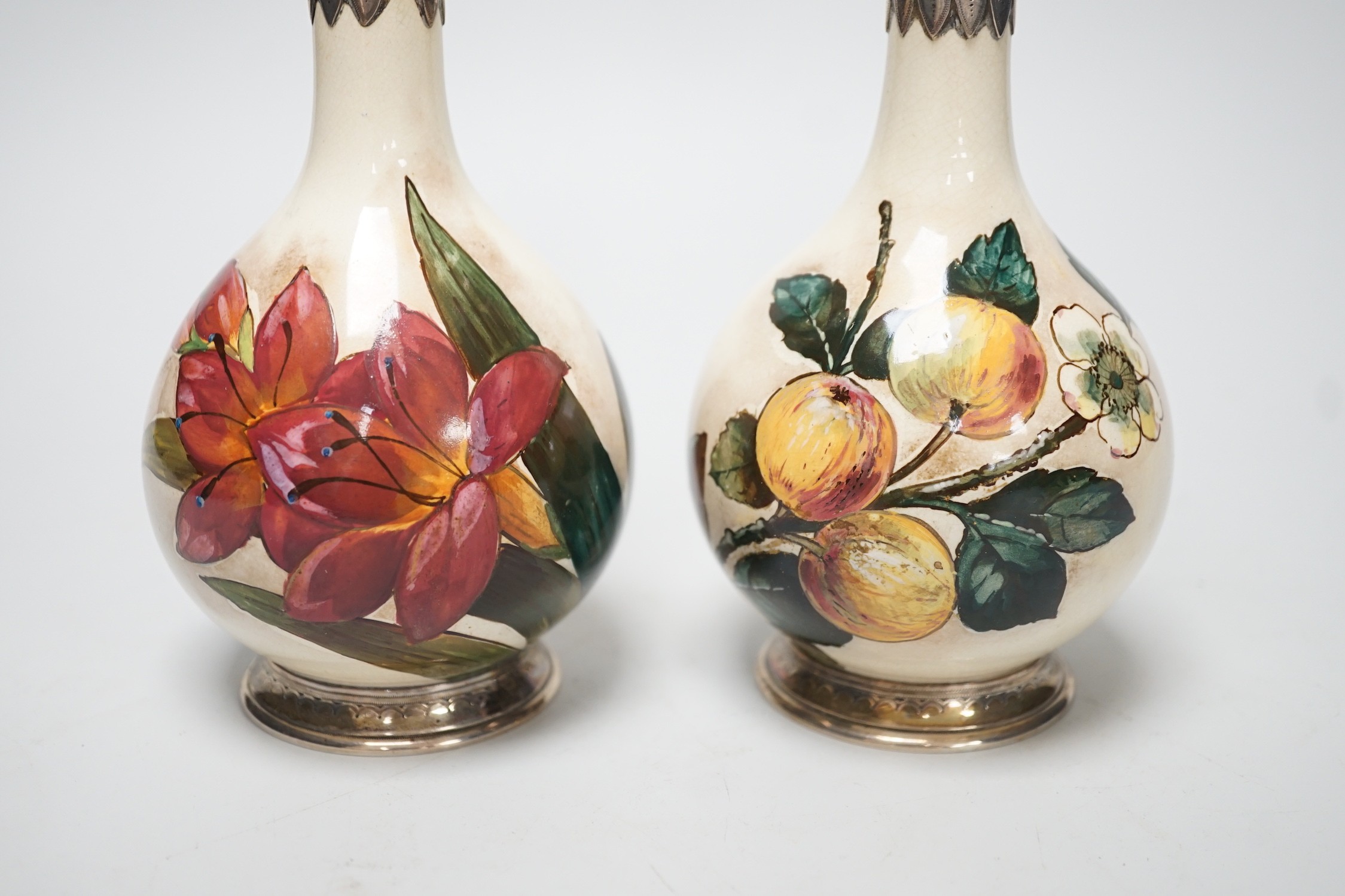 A pair of Victorian silver mounted floral painted earthenware bottle vases. 21cm high - Image 2 of 7