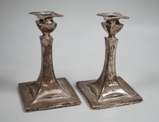 A pair of early 20th century Art Nouveau silver mounted candlesticks, marks rubbed (a.f.), height