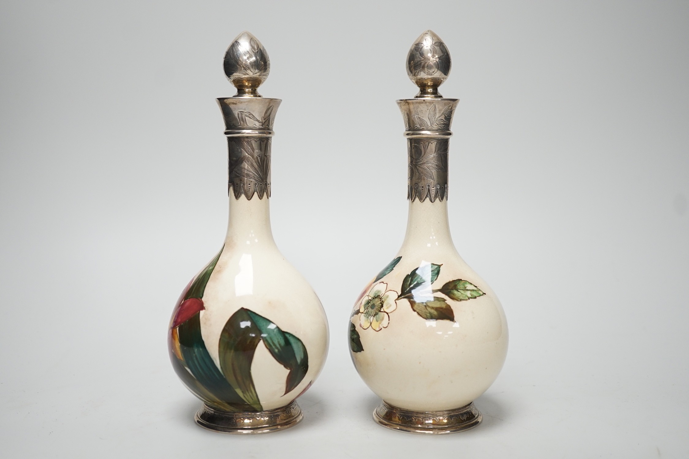 A pair of Victorian silver mounted floral painted earthenware bottle vases. 21cm high - Image 3 of 7