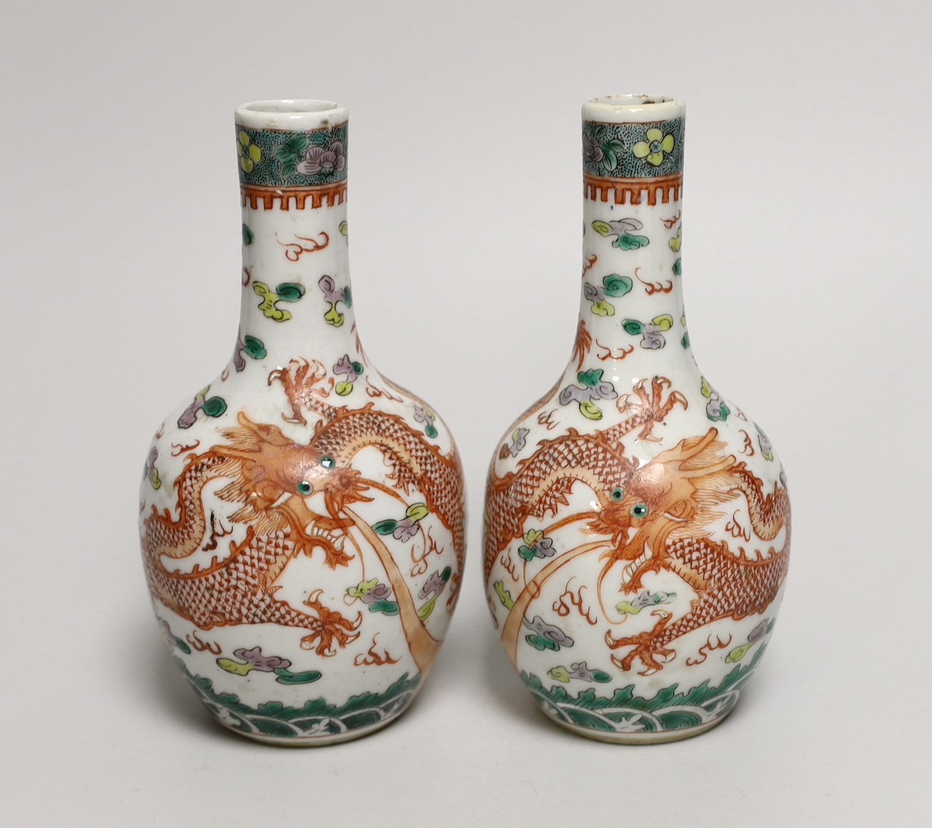 A pair of Chinese enamelled porcelain ‘dragon’ bottle vases, Kangxi marks probably Guangxu period,