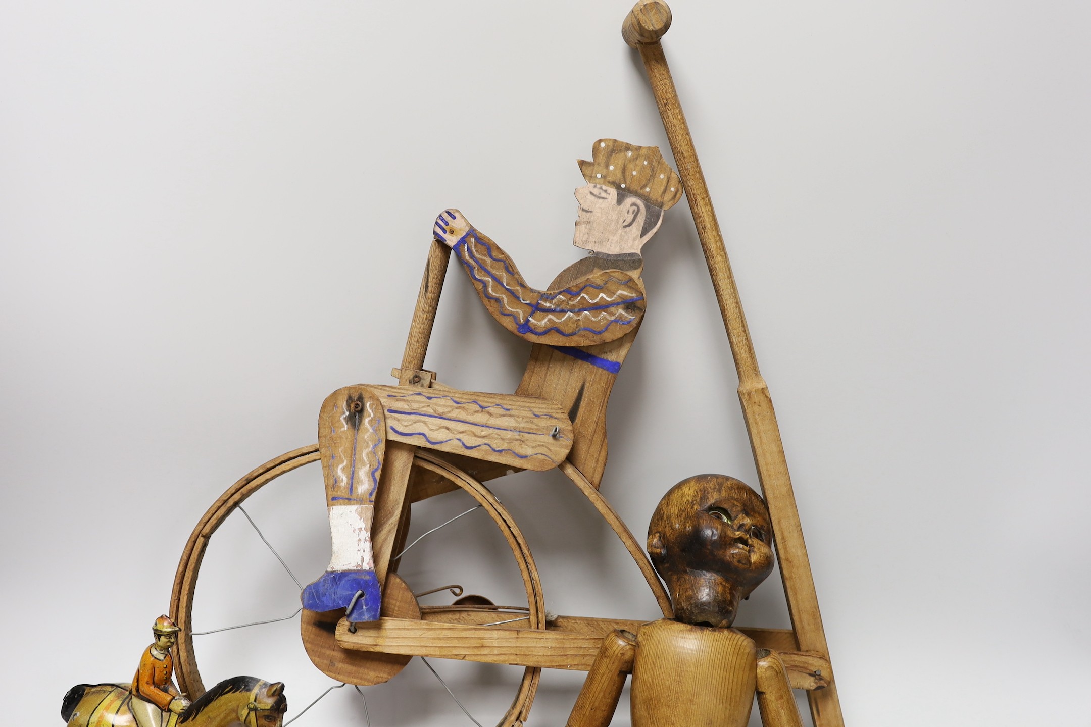 A Victorian carved pine jointed peg doll, jointed wood uni-cyclist toy, two abacuses and an early - Image 2 of 5