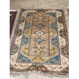 A modern Caucasian style fawn ground rug, 230 x 168cm