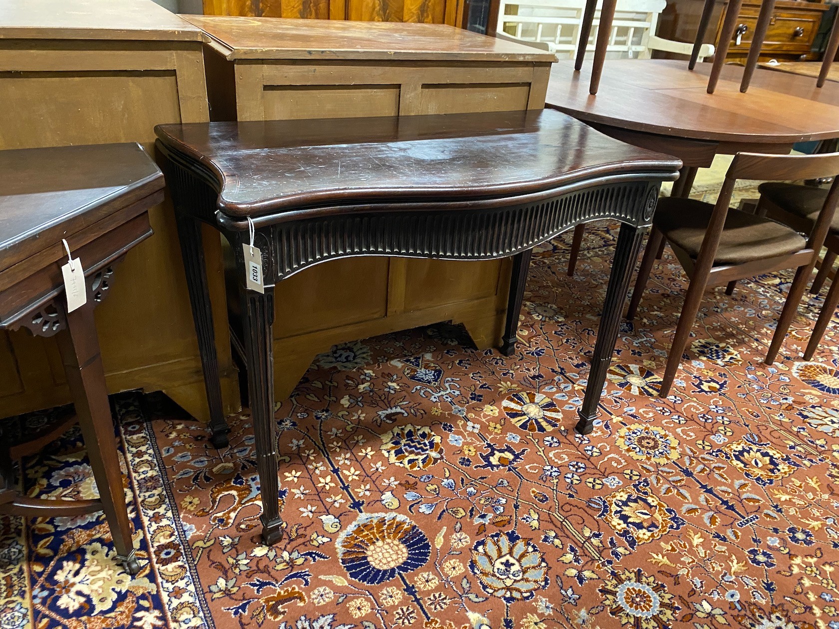 A George III mahogany serpentine folding card table, width 93cm, depth 48cm, height 72cm