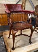 A Victorian mahogany part upholstered desk chair with saddle seat and crinoline stretcher, width