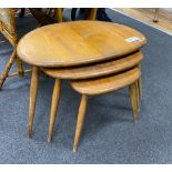 A nest of three Ercol light elm and beech 'pebble' tables, width 65cm, depth 42cm, height 40cm