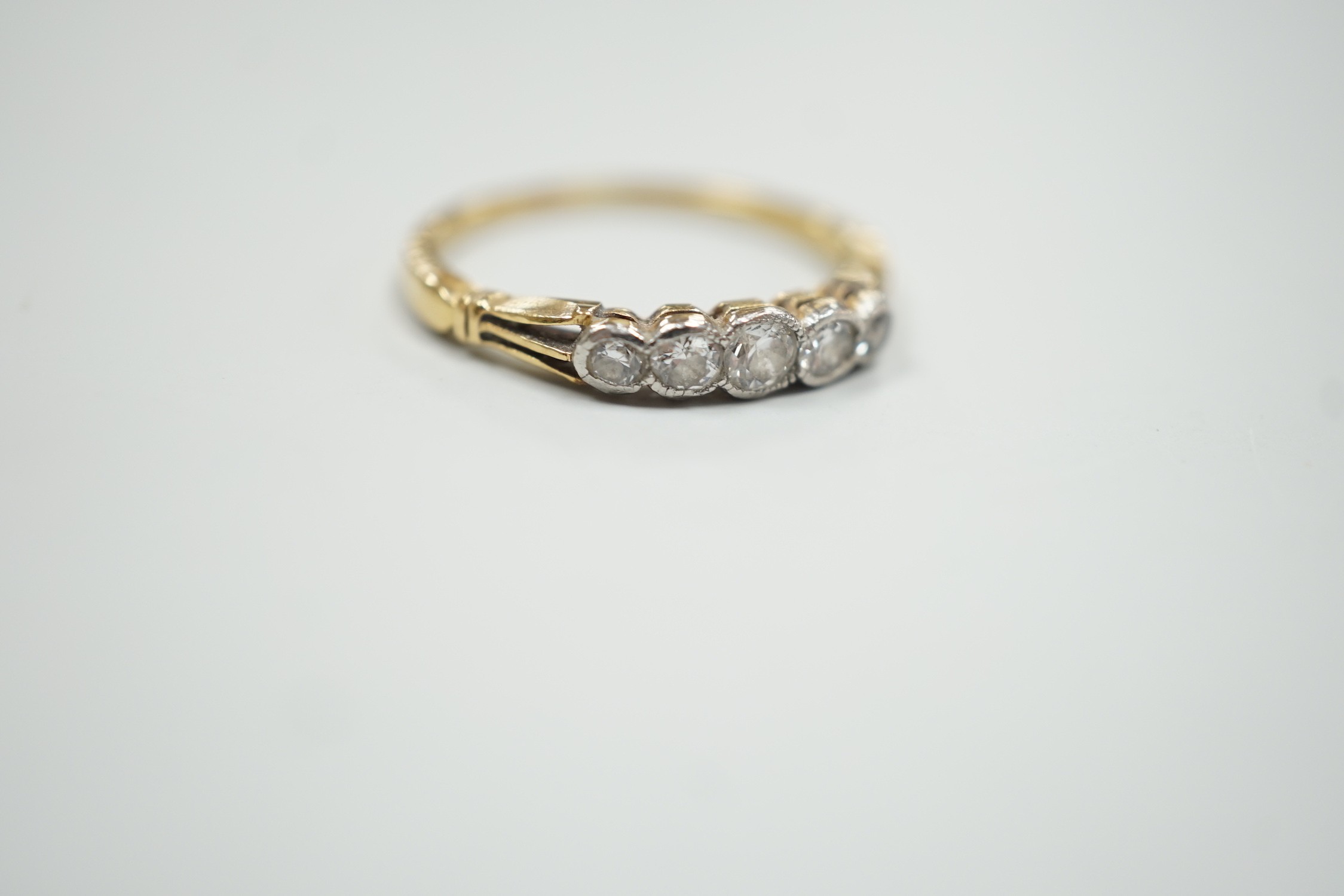 A yellow metal and graduated collet set five stone diamond ring, size N, gross weight 2.2 grams. - Image 4 of 4