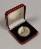 A cased Pobjoy mint tri-gold golden jubilee 1 crown coin, 2002, no. 483/999