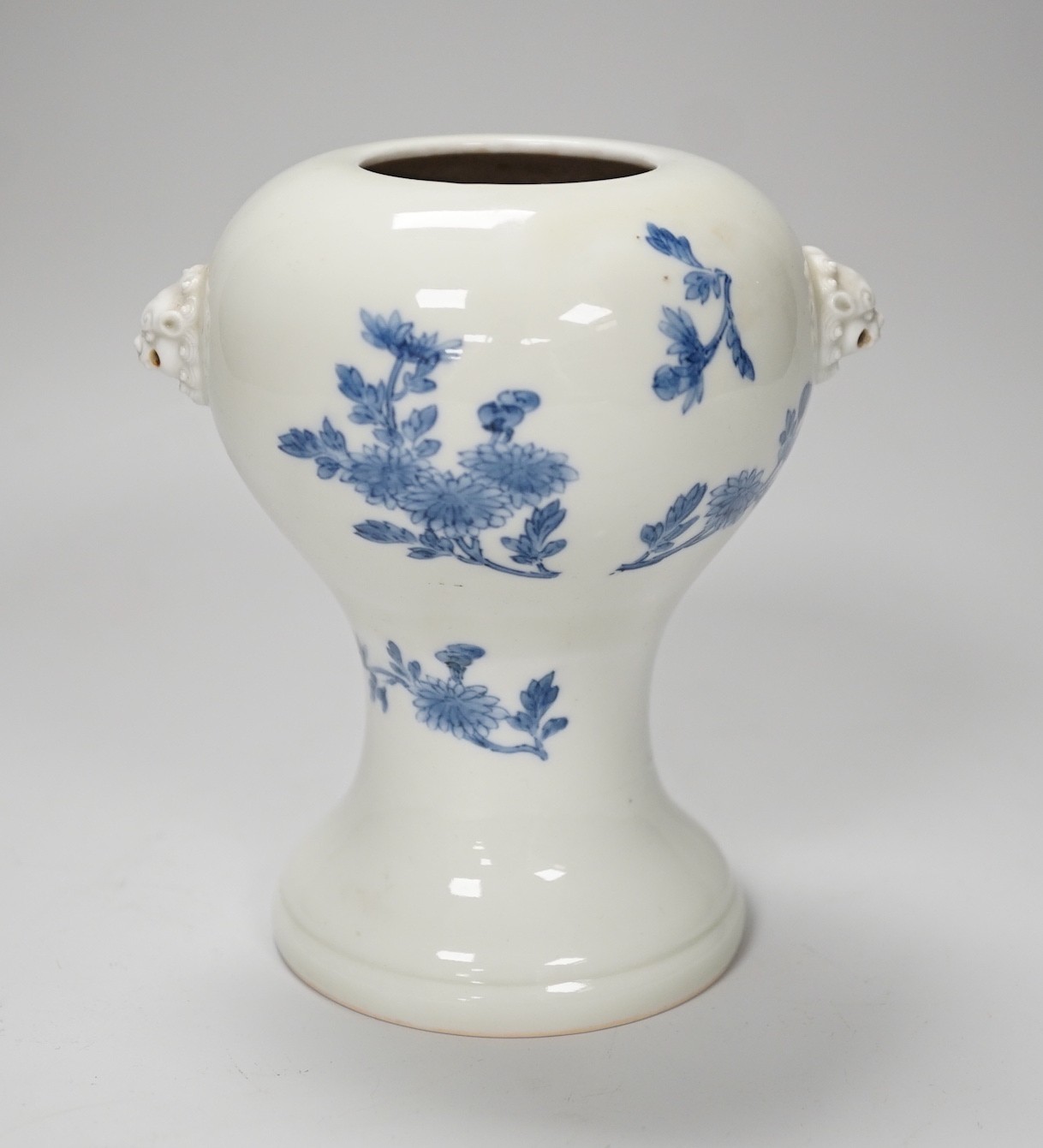 A Japanese blue and white vase, Meiji period, possibly Hirado, with lion mask handles. 13cm high