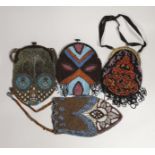 Two Edwardian bead worked bags and two later 1920’s beaded bags with Bakelite frames(4).