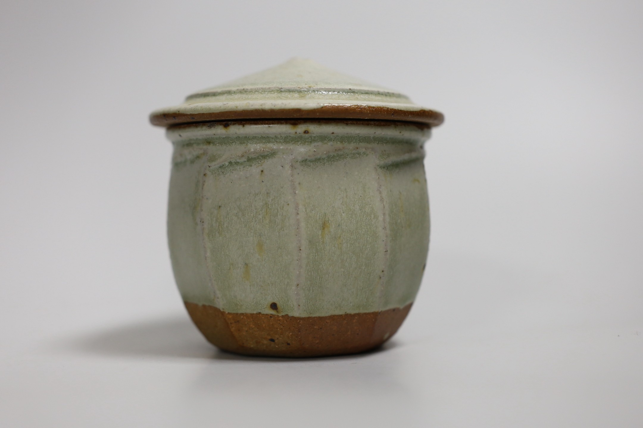 Richard Batterham (1936 – 2021), a cut sided stoneware jar and pointed cover with sage coloured - Image 2 of 5